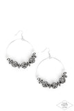 A stunning array of studded silver accents, oversized silver beads, and hematite rhinestone encrusted black beads are threaded along a dainty silver wire hoop, resulting in a dazzling pop of color. Earring attaches to a standard fishhook fitting.