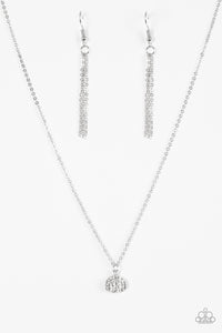 Encrusted in glassy white rhinestones, an asymmetrical silver frame swings from the bottom of a shimmery silver chain for a timeless look. Features an adjustable clasp closure.  Sold as one individual necklace. Includes one pair of matching earrings.