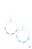 Dainty silver beads, refreshing turquoise, and earthy white stone beads slide along a dainty silver hoop for a seasonal look. Earring attaches to a standard fishhook fitti