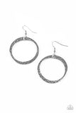 Delicately hammered in light-catching detail, an asymmetrical silver hoop swings from the ear for an artisan inspired look. Earring attaches to a standard fishhook fitting.