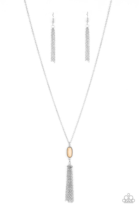 Swinging from a lengthened silver chain, a faceted brown bead gives way to a shimmery silver tassel for a whimsical look. Features an adjustable clasp closure.