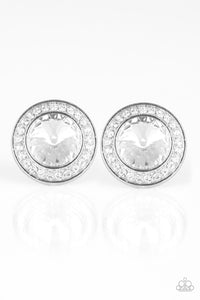 A faceted white gem is pressed into the center of a shimmery silver frame encrusted in a ring of glassy white rhinestones for a timeless fashion. Earring attaches to a standard post fitting.