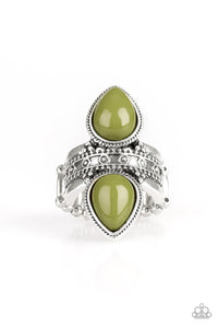 Tinted in the zesty green hue of Guacamole, polished teardrop beads flank an ornately studded silver band for a trendsetting look. Features a stretchy band for a flexible fit.