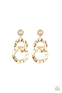 Hammered gold rings link at the bottom of a solitaire white pearl dotted frame for a refined edge. Earring attaches to a standard post fitting.