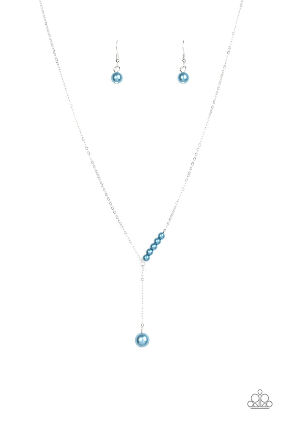 A solitaire blue pearl swings from the bottom of a glistening silver chain, creating a timeless extended pendant below the collar. A section of dainty blue pearls dot one side of the chain for a refined asymmetrical finish. Features an adjustable clasp closure.  Sold as one individual necklace. Includes one pair of matching earrings.