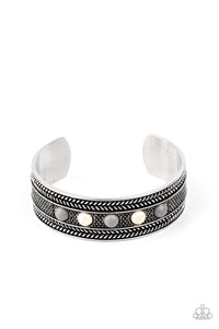 Dainty white and Sleet stone beads are encrusted along the front of an ornate silver cuff studded and embossed in antiqued rope-like patterns