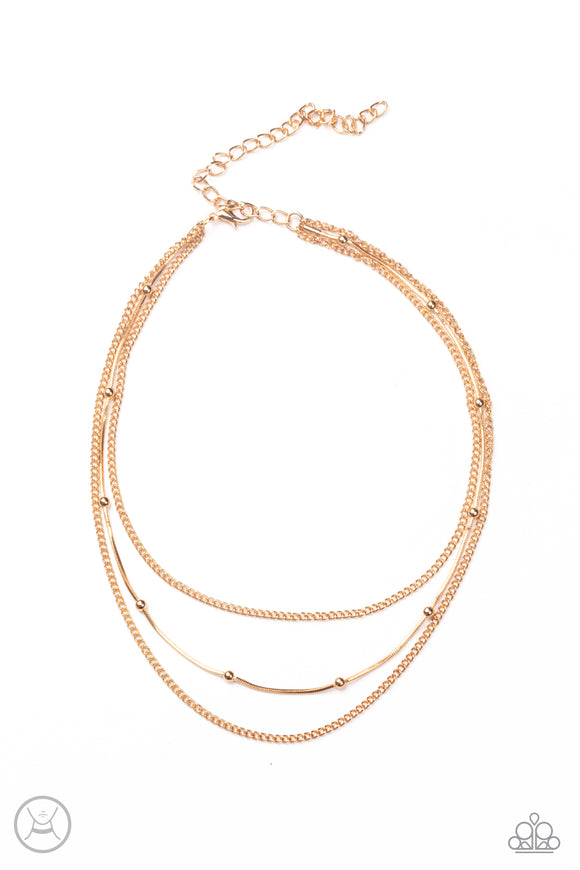 Infused with two dainty gold chains, a gold beaded snake chain wraps around the neck for a stunning layered look. Features an adjustable clasp closure