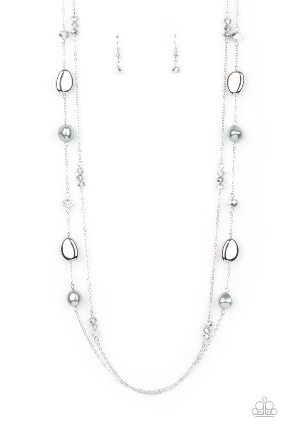 <p>A dainty silver chain adorned in trios of hematite flecked crystal-like beads layers with a chain dotted with matching crystal-like accents and imperfect silver and pearly beads across the chest for a refined flair. Features an adjustable clasp closure.</p> <p><i> Sold as one individual necklace. Includes one pair of matching earrings.</i></p>