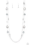 <p>A dainty silver chain adorned in trios of hematite flecked crystal-like beads layers with a chain dotted with matching crystal-like accents and imperfect silver and pearly beads across the chest for a refined flair. Features an adjustable clasp closure.</p> <p><i> Sold as one individual necklace. Includes one pair of matching earrings.</i></p>