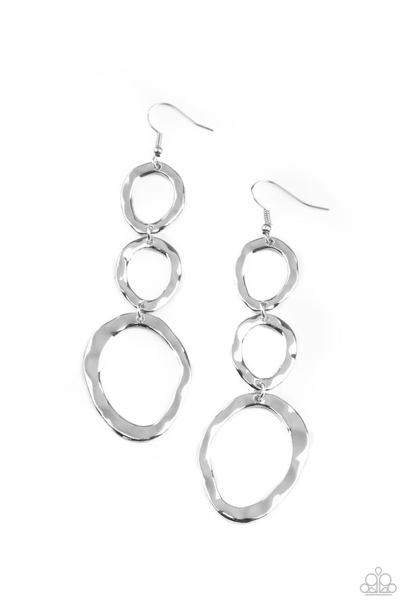 Delicately hammered in rippling shimmer, asymmetrical silver ovals link into an artisan inspired lure. Earring attaches to a standard fishhook fitting.