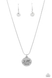 A glistening silver disc is stamped in the bible verse, "Be still and know that I am God. Psalm 16:13," creating an inspiring pendant below the collar. Features an adjustable clasp closure.