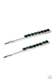 Sparkly rows of glittery green rhinestones embellish the fronts of two silver bobby pins, creating a glamorous duo.