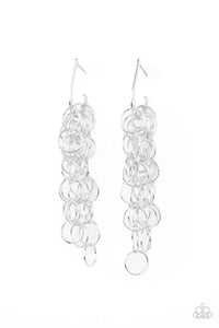 Strands of shiny silver links cascade from the bottom of a dainty hook shaped hoop, creating a rebellious fringe. Hoop measures approximately 1/2" in diameter. Earring attaches to a standard post fitting.  Sold as one pair of hoop earrings.