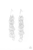 Strands of shiny silver links cascade from the bottom of a dainty hook shaped hoop, creating a rebellious fringe. Hoop measures approximately 1/2" in diameter. Earring attaches to a standard post fitting.  Sold as one pair of hoop earrings.