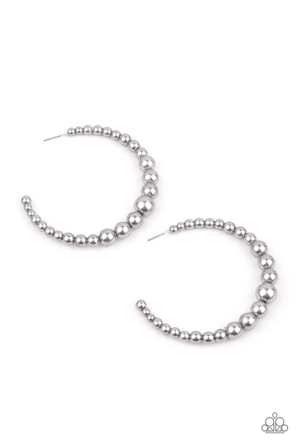 Gradually increasing in size at the center, a classic row of pearly silver beads are threaded along an oversized hoop for a posh finish. Earring attaches to a standard post fitting. Hoop measures approximately 2 1/4