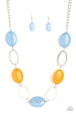 Shiny silver ovals and cloudy Cerulean and Marigold beads delicately link across the chest, creating a whimsical pop of color. Features an adjustable clasp closure.