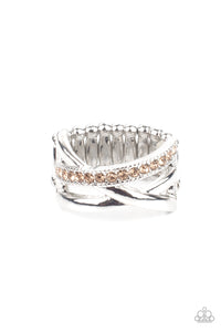 Bands of crisscrossing shining silver bars are highlighted by a row of glittering light topaz rhinestones for a ritzy finish across the finger. Features a stretchy band for a flexible fit.