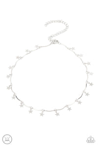 A collection of dainty silver stars and curved silver bars delicately connect around the neck, creating a stellar fringe. Features an adjustable clasp closure.