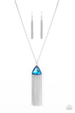 Featuring an iridescent UV shimmer, an oversized blue triangular gem swings from the bottom of a lengthened silver chain. A curtain of silver chains streams out from the bottom of the sparkly pendant, adding playful movement to the glamorous statement piece. Features an adjustable clasp closure.