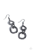 Asymmetrical and hammered gunmetal rings link into an edgy metallic lure, creating a bold industrial inspired look. Earring attaches to a standard fishhook fitting