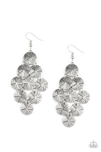 Etched in linear textures, star stamped silver discs cascade from a netted backdrop, creating a noisemaking lure. Earring attaches to a standard fishhook fitting.