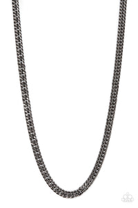 Featuring flashy faceted finishes, oval gunmetal links daringly interlock into a bold curb-like chain across the chest of a classic urban finish. Features an adjustable clasp closure.