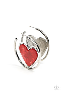 Featuring a faux marble finish, a fiery red heart nestles inside of an asymmetrical silver hoop for a flirtatious pop of color. Earring attaches to a standard post fitting. Hoop measures approximately 2" in diameter.