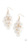 Tiers of white shell-like discs cascade from a gold netted backdrop, resulting in a summery shimmer. Earring attaches to a standard fishhook fitting.