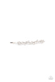 A starry collection of glassy white rhinestones delicately cluster along the front of a classic silver bobby pin, invoking an effervescent elegance.