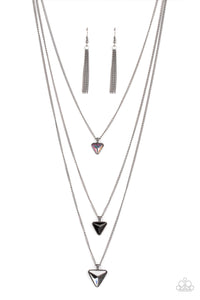 Glassy iridescent, black, and smoky triangular gems gradually increase in size as they swing from the bottoms of extended gunmetal chains, layering into an edgy shimmer across the chest. Features an adjustable clasp closure.