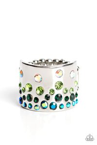 Featuring iridescent and glassy finishes, glitzy rows of blue, green, and multicolored rhinestones are haphazardly sprinkled across the front of a thick silver band for a colorful splash of sparkle. Features a stretchy band for a flexible fit.