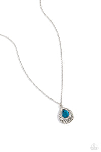 Bordered in glassy white rhinestones, an oversized blue teardrop sits atop a 3-dimensional frame swirling with silver filigree for a glamorous look below the collar. Features an adjustable clasp closure