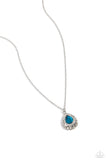 Bordered in glassy white rhinestones, an oversized blue teardrop sits atop a 3-dimensional frame swirling with silver filigree for a glamorous look below the collar. Features an adjustable clasp closure