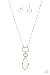 Featuring an iridescent shimmer, rectangular, oval, and asymmetrical white shell-like accents link from the bottom of an extended silver chain for a beach inspired fashion. Features an adjustable clasp closure.