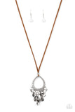 Infused with a bubbly fringe of white and glassy beads, tassels of wilted silver teardrops cascade from the bottom of a scalloped teardrop frame. The whimsical pendant is looped along a brown suede cord and held in place with a single silver bead, resulting in a free-spirted display across the chest. Features an adjustable clasp closure.