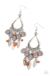 An earthy assortment of Ultimate Gray stones, wooden beads, and rustic silver frames cascade from the bottom of a studded silver teardrop, resulting in an artisan inspired fringe. Earring attaches to a standard fishhook fitting.