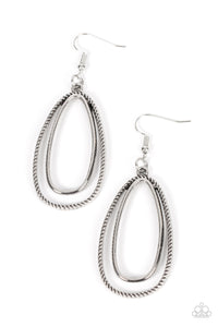 <p>Layered one inside the other, a smooth oval hoop brushed in antiqued silver texture is paired with a rustic frame wrapped in rope-like texture creating an airy, yet rustic design. Earring attaches to a standard fishhook fitting.</p> <p>&nbsp;</p>