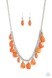 Featuring oval, round, teardrop, and marquise cuts, a fanciful collection of opaque and translucent orange beads sways from a bold silver chain. The faceted beads are set in silver prong settings, giving a spunky vibe to the whimsical collection as it lays below the collar. Features an adjustable clasp closure.