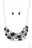 A mismatched collection of shiny silver ovals, bubbly white rhinestones, and black oval beads collide into three separate frames below the collar for a colorful yet contemporary style. Features an adjustable clasp closure.