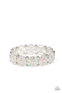 Separated by pairs of silver beads, iridescent rhinestone encrusted silver frames glitter along stretchy bands around the wrist for an out-of-this-world sparkle. Due to its prismatic palette, color may vary.