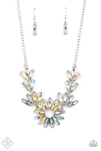 Featuring oblong marquise cuts, a collection of iridescent gems join into leafy frames below the collar. Radiating with the same iridescent intensity, even more stellar rhinestones fan out into a circular focal point, resulting in a celestial centerpiece. Features an adjustable clasp closure. Due to its prismatic palette, color may var