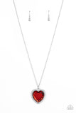 Bordered in glassy white rhinestones, an oversized red heart gem sparkles from the bottom of an extended silver chain for a flirty finish. Features an adjustable clasp closure.