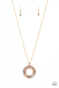 Brilliant emerald cut rhinestones brushed in an iridescent shimmer are pressed inside a wide circular gold frame, creating a glitzy pendant at the bottom of a dainty gold chain. Features an adjustable clasp closure. Due to its prismatic palette, color may vary.