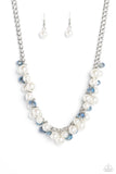 A faceted collection of glassy, blue crystal-like beads and classic white pearls in varying sizes flickers and flashes below the collar on a thick silver curb chain for a refined shimmer. Features an adjustable clasp closure.