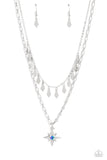 A three-dimensional silver star, dotted with a single blue-iridescent rhinestone glides on a paperclip chain down the neckline for an out of-this-world vibe. Flat and flared silver frames dance above the star pendant from an uppermost chain, adding a shimmery layered look to the refined palette. Features an adjustable clasp closure. Due to its prismatic palette, color may vary.  Sold as one individual necklace. Includes one pair of matching 