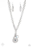 A harmonious compilation of charms, featuring tranquil shades of blue and accents of black, gather at the bottom of a handcrafted chain. Elongated paperclip links and oversized jump rings interlock as they fall down the neckline, leading to the boisterous collection of charms, which include a rectangular silver plate stamped with the phrase, "good vibes," a warped silver disc embossed in a sunburst pattern, and an eye with exaggerated eyelashes. Features an adjustable clasp closure.