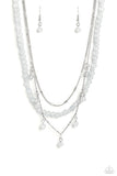 <p>A strand of gray stone beads is paired with two strands of classic silver chain, creating effortless layers along the neckline. One of the silver chains is dotted with sections of flattened silver bars, while the other is adorned with a sampling of gray stone beading that infuses the design with playful movement. Features an adjustable clasp closure.</p> <p><i> Sold as one individual necklace. Includes one pair of matching earrings.</i></p>