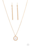 Encased in a sleek gold frame, a white, shell-like disc swings from the bottom of a dainty gold chain below the collar. Embossed onto the iridescent shell, a sun sets over the ocean waves for a beach-inspired statement. Features an adjustable clasp closure.