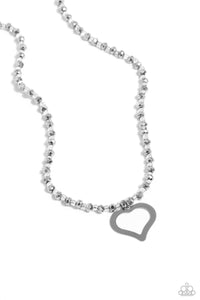 Infused along an invisible string, a collection of faceted hematite beads alternate with clear seed beads to create a dazzling display below the neckline. An airy silver heart dangles from the high-sheen display for a touch of charm. Features an adjustable clasp closur