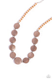 Brushed in a scratched finish, shiny brown pearl discs alternate with silver beads as they link around the neck on a Doe and Tender Peach beaded strand for a refined statement. Features an adjustable clasp closure